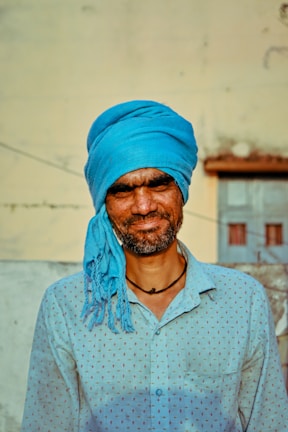 Man wearing a stylish Punjabi shirt in a bright outdoor setting.