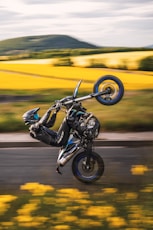 a person on a motorcycle doing a wheelie