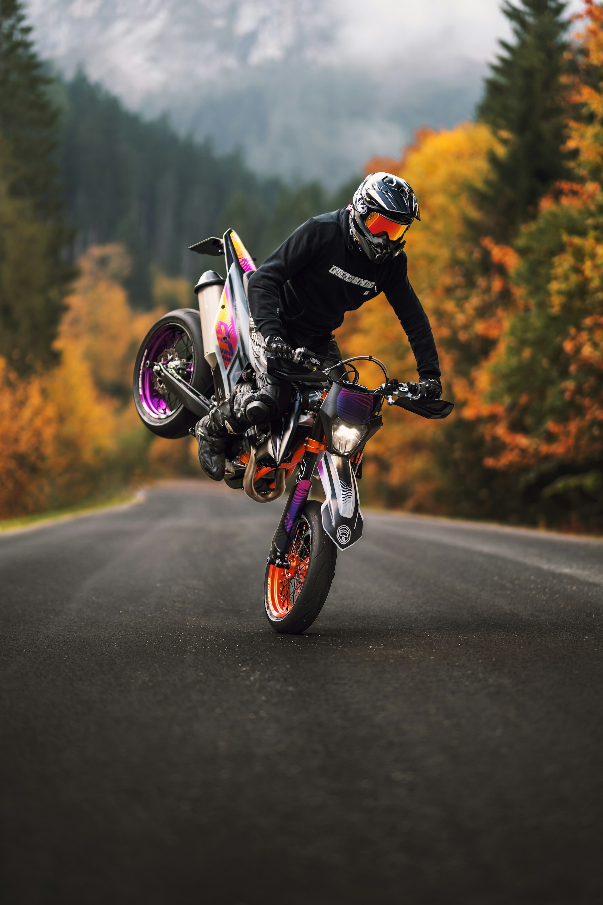 a person riding a motorcycle on a road