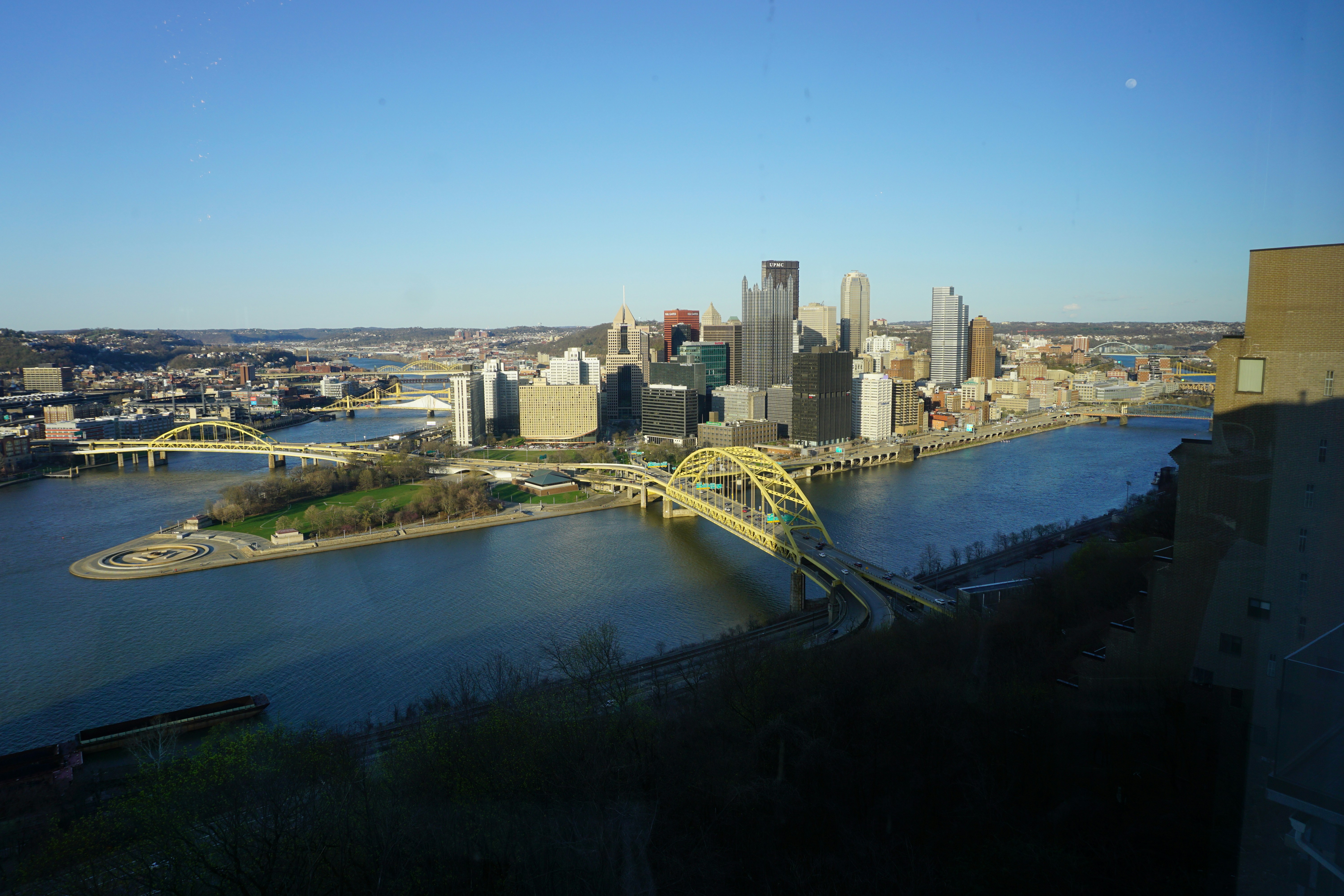 a view of a city and a bridge over a river