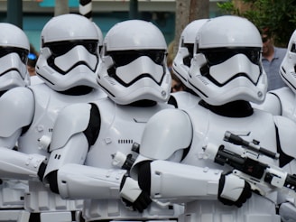 a group of star wars stormtroopers are lined up
