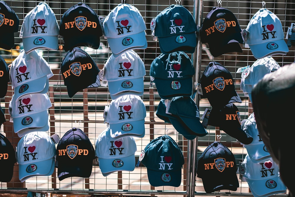 a bunch of hats that are on a rack