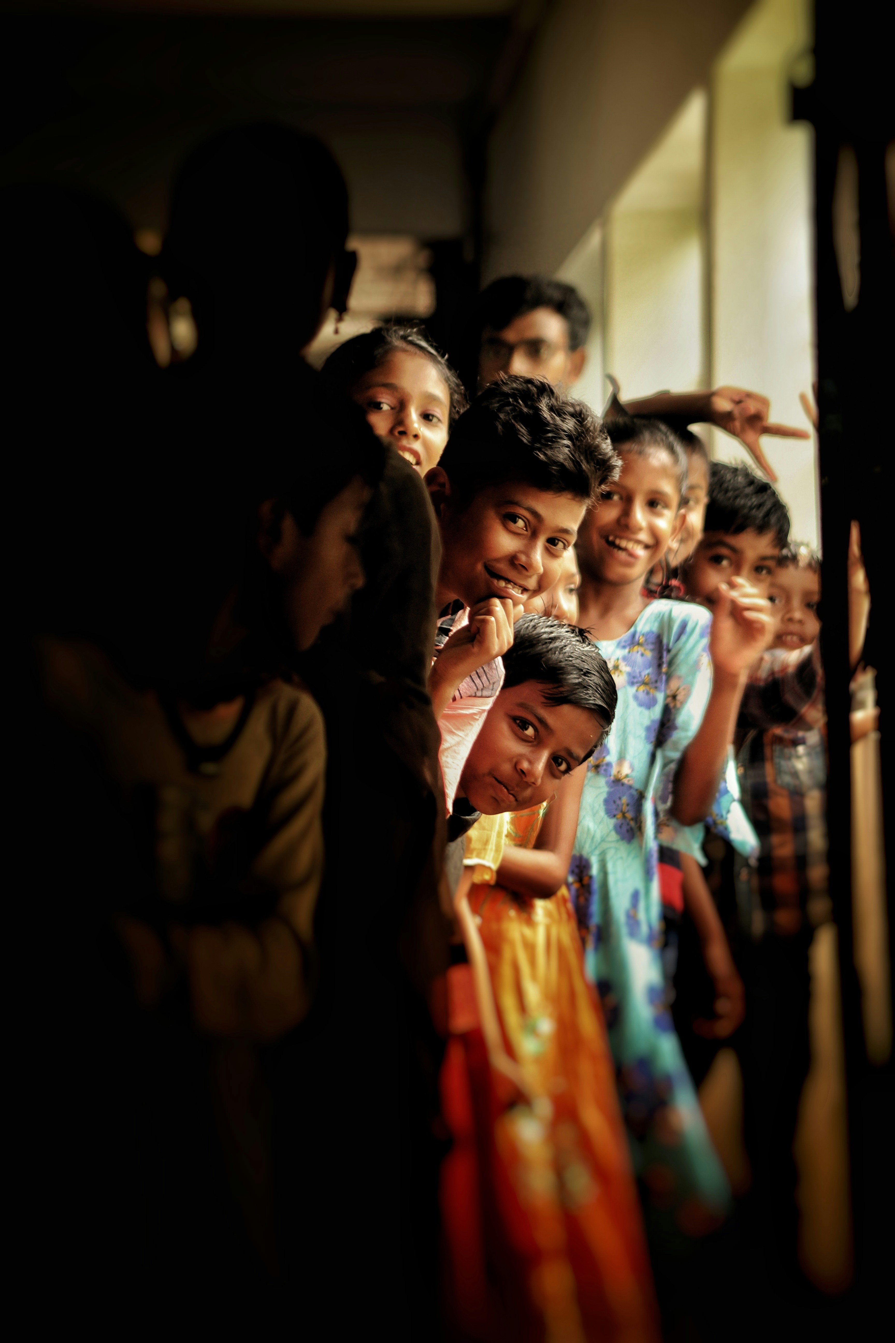 a group of children standing next to each other