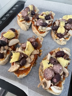 A slice of sausage cheese butter swim biscuit casserole on a plate, showing fluffy biscuit layers and melted cheddar.