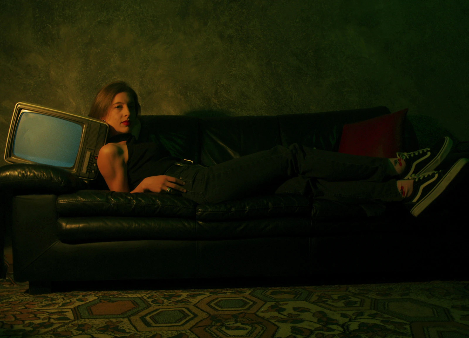 Woman relaxing on a couch streaming a show