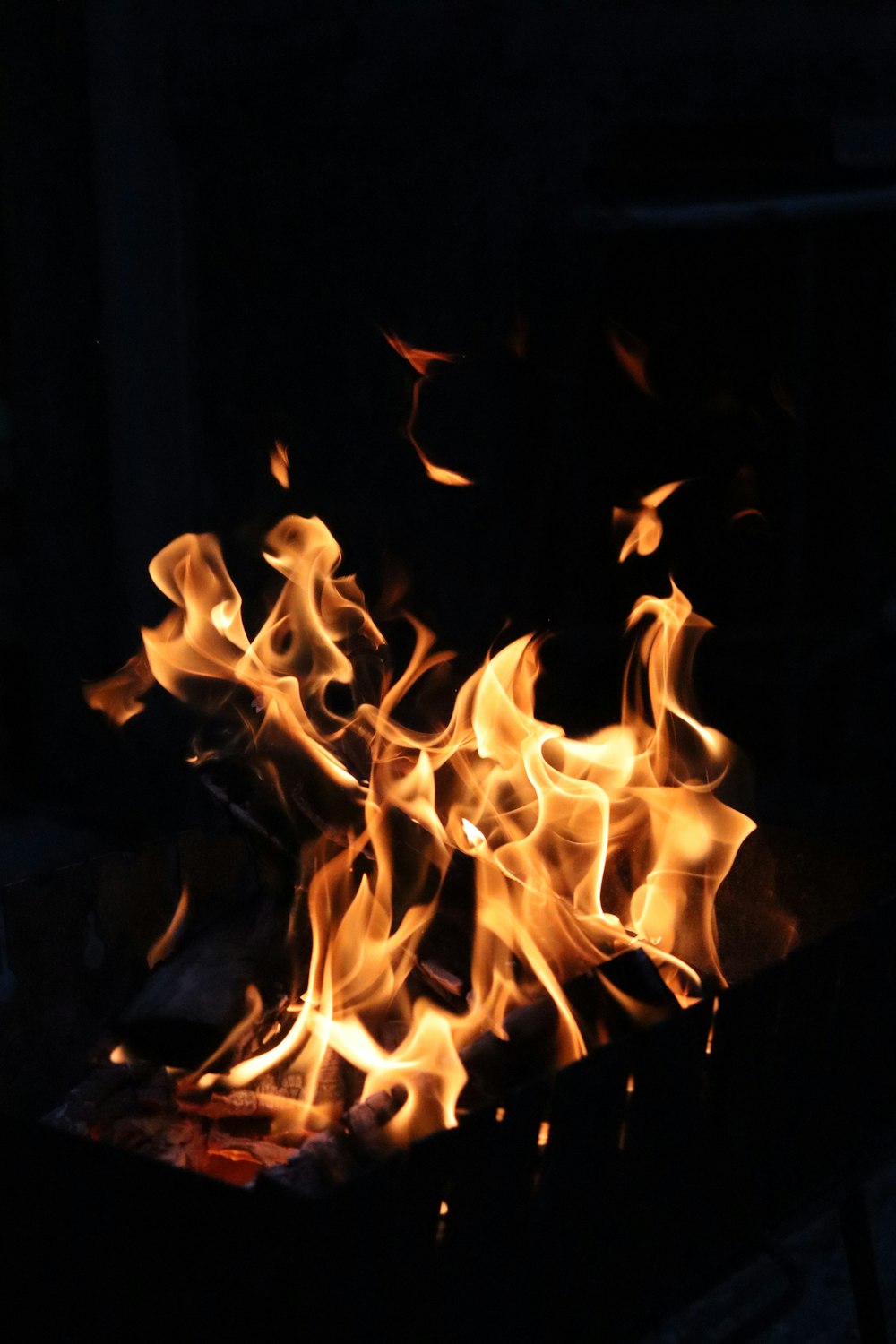 a close up of a fire in the dark