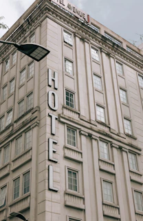 a large tall tower with a clock on the side of a building
