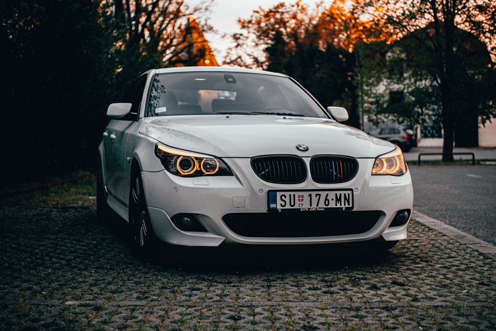 a white car parked on the side of the road