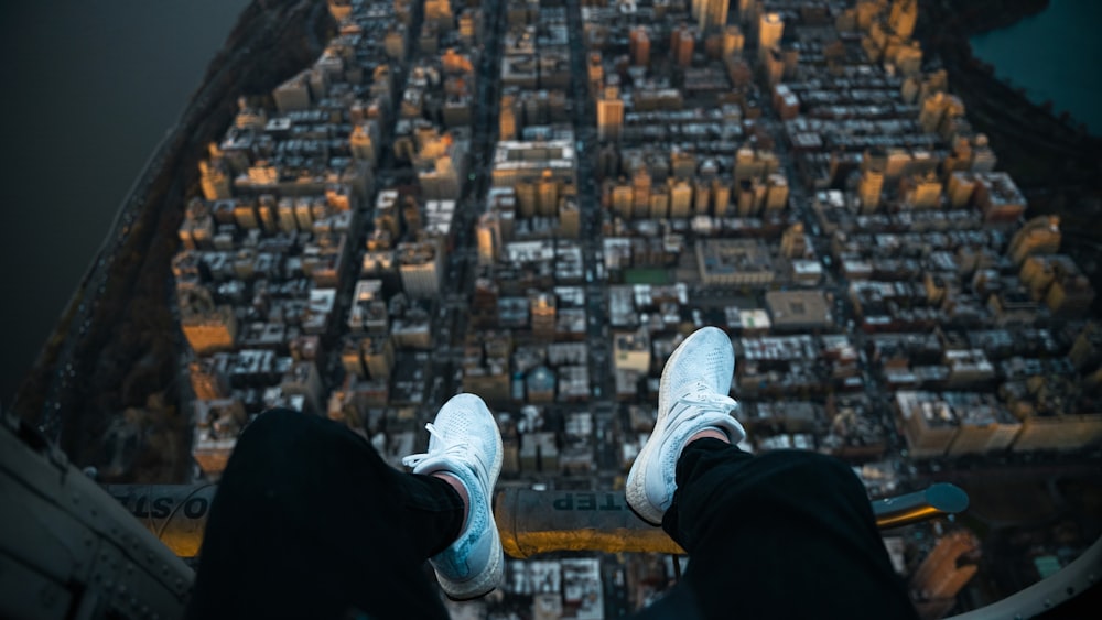 a person standing on top of a tall building