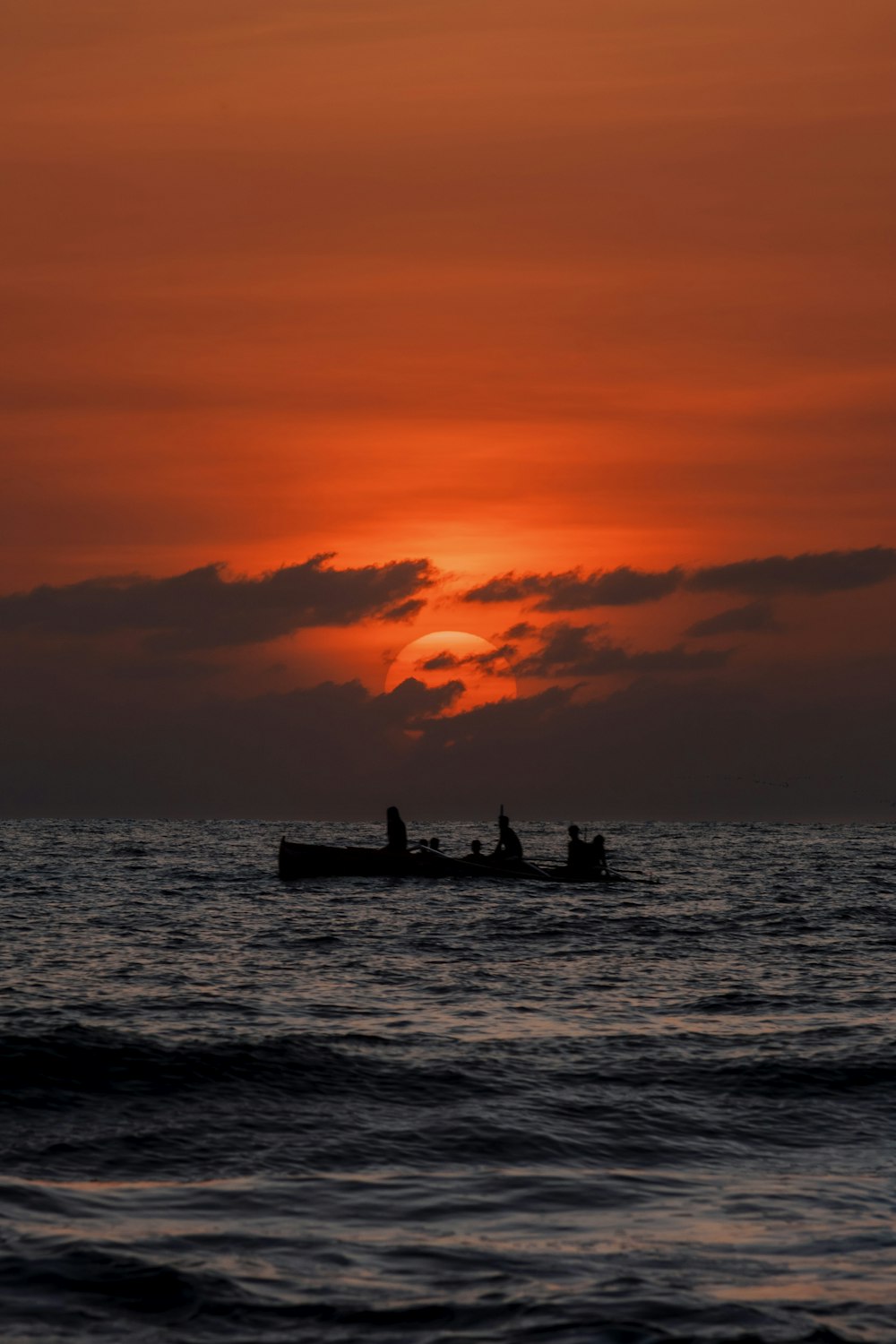 a couple of people in a boat on a body of water