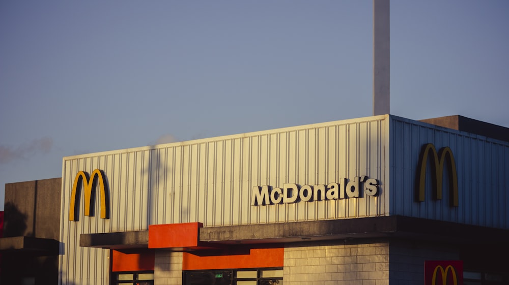 a mcdonald's restaurant with a smoke stack sticking out of the roof