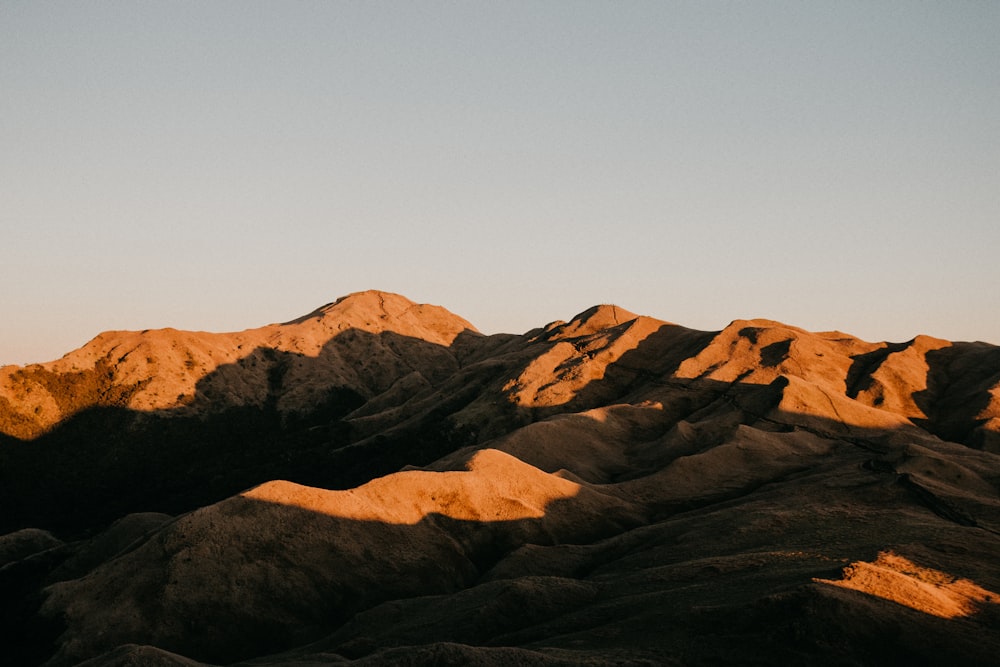 a view of a mountain range at sunset