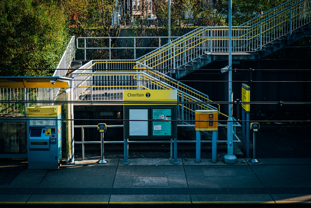 a set of stairs leading up to a train station