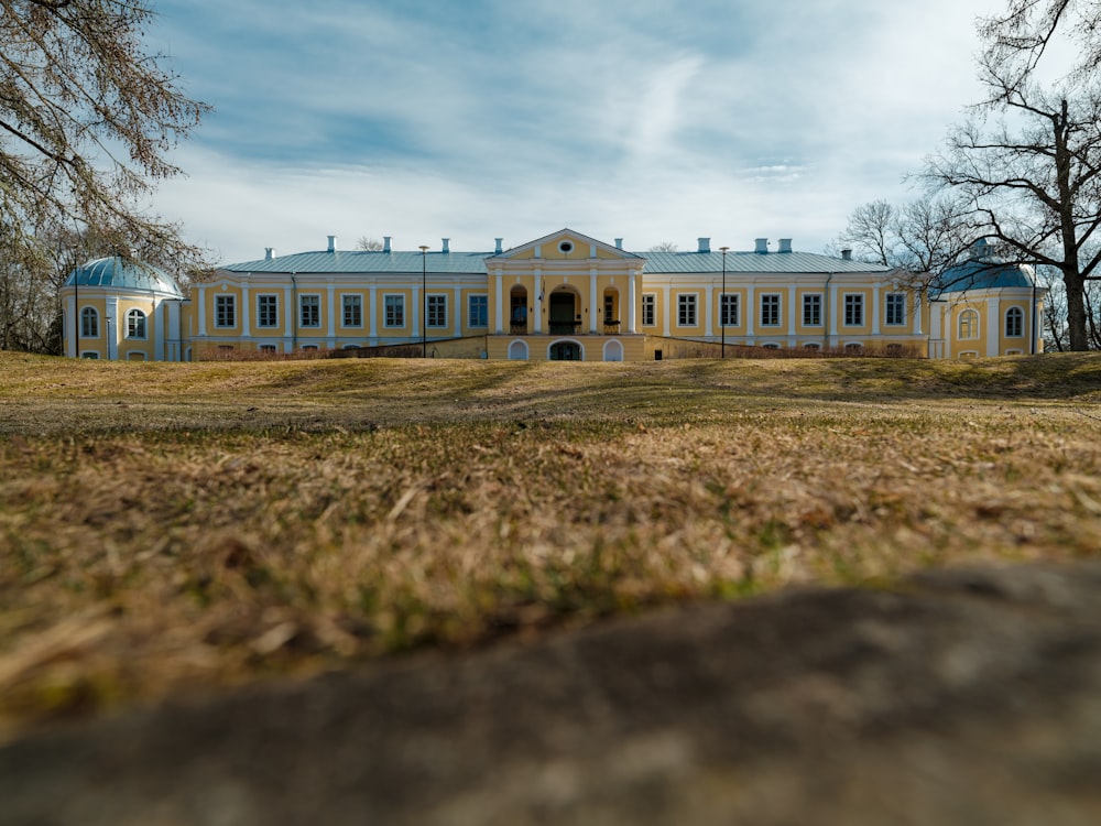 a large white house with a blue roof