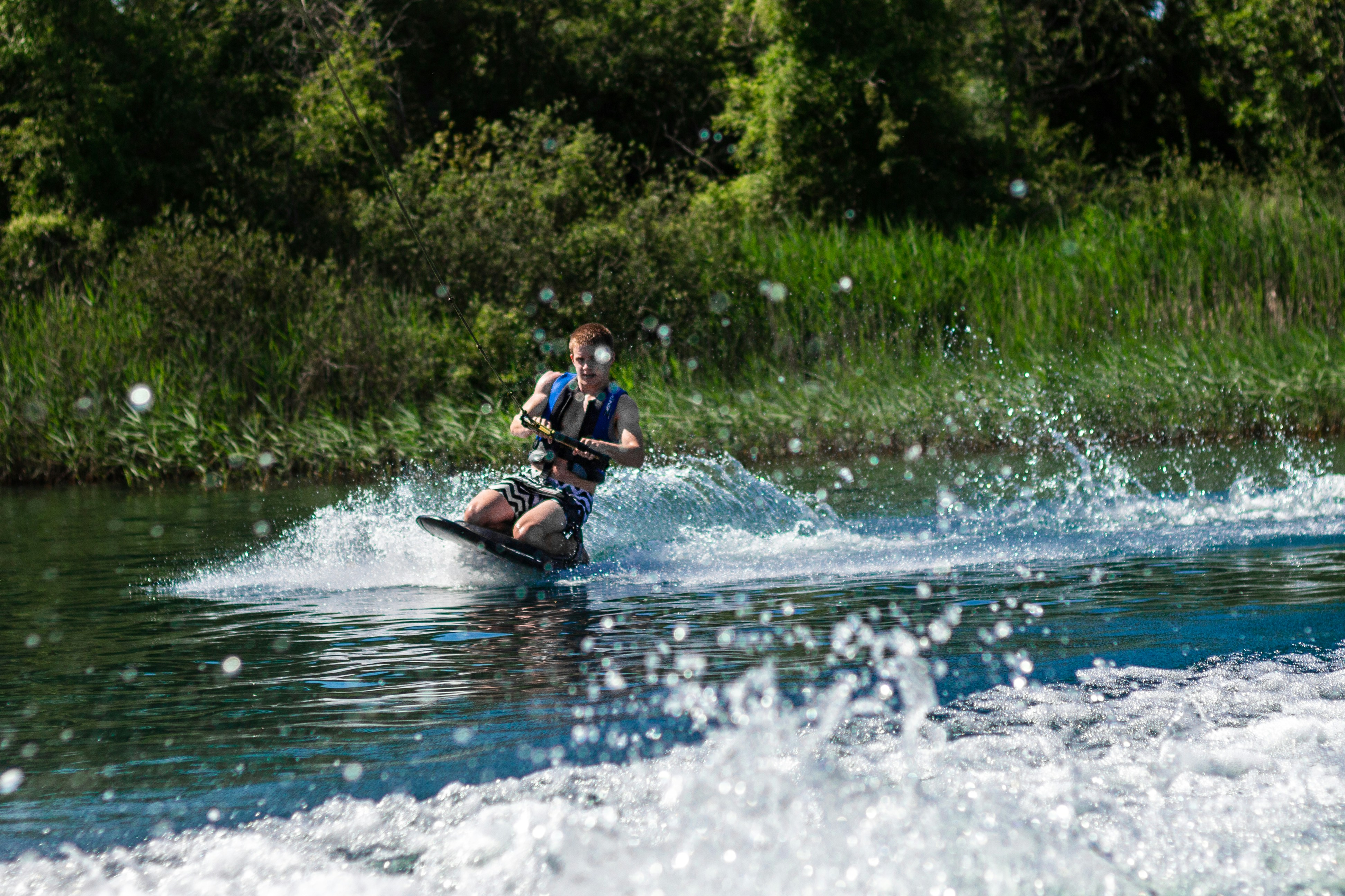 a man riding a jet ski on top of a body of water