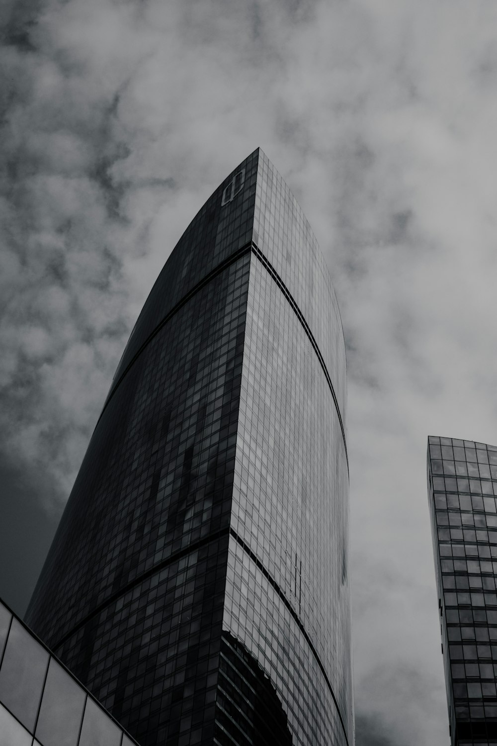 a black and white photo of two tall buildings