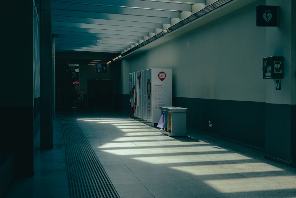 a long hallway with a sign on the wall