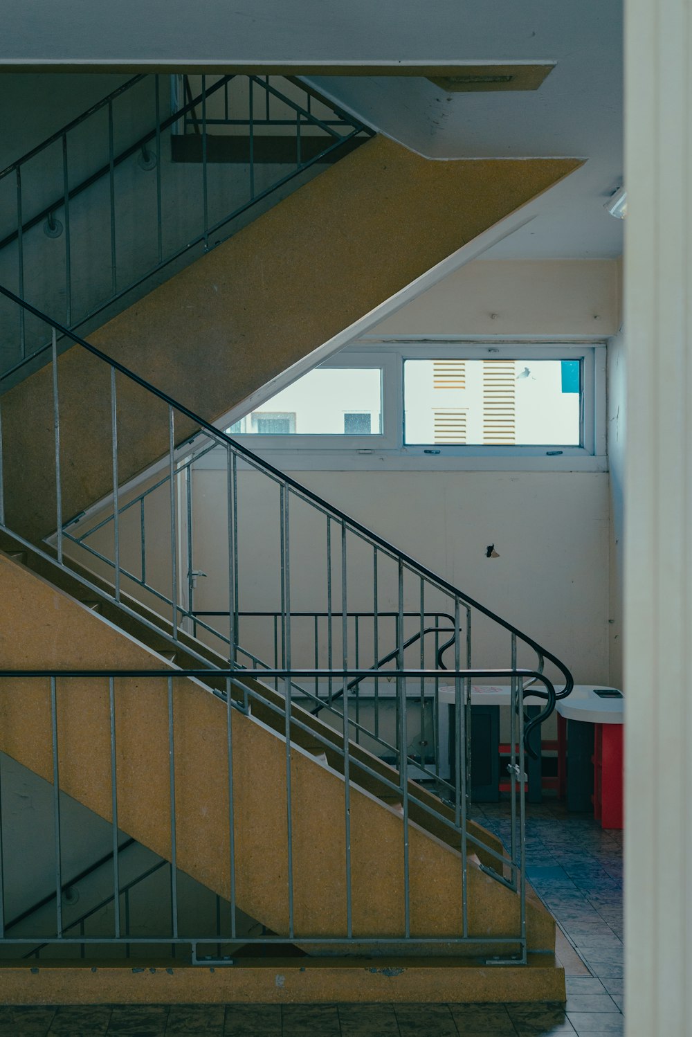 a stair case in a building with a window