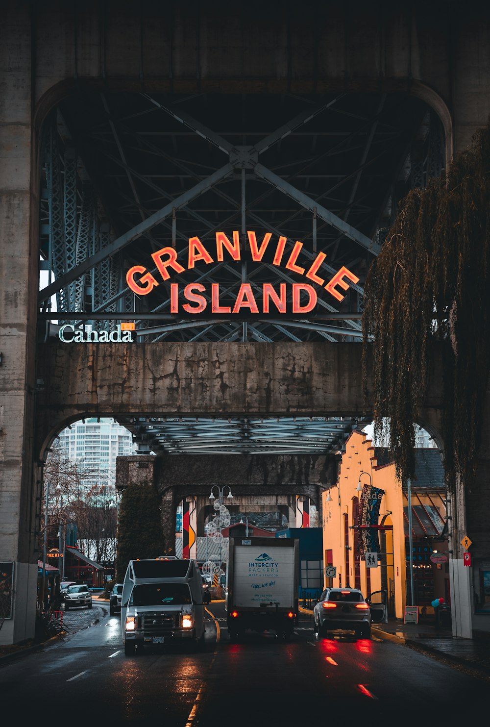 a bridge with a sign that reads granville island