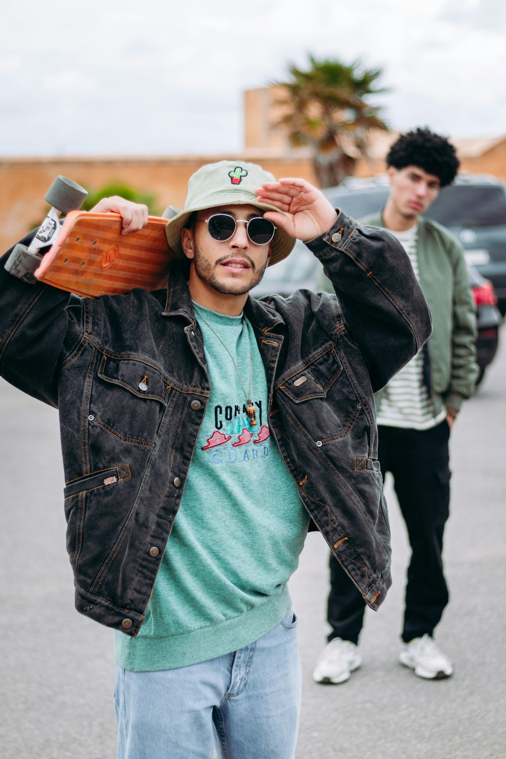 a man with a skateboard on his shoulder