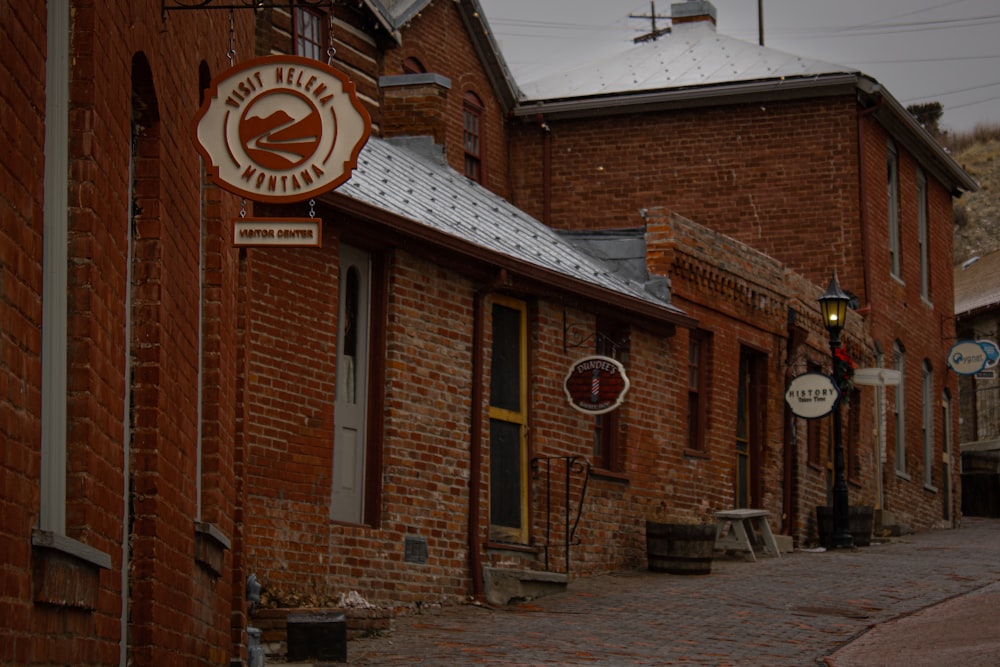 a brick building with a sign on the side of it