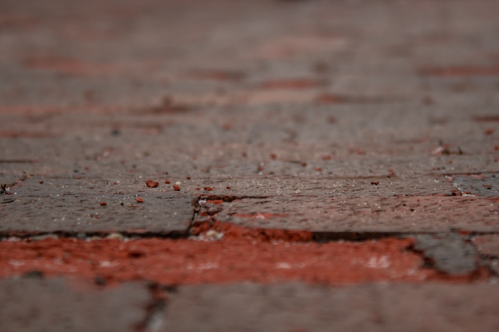a close up of a red brick surface