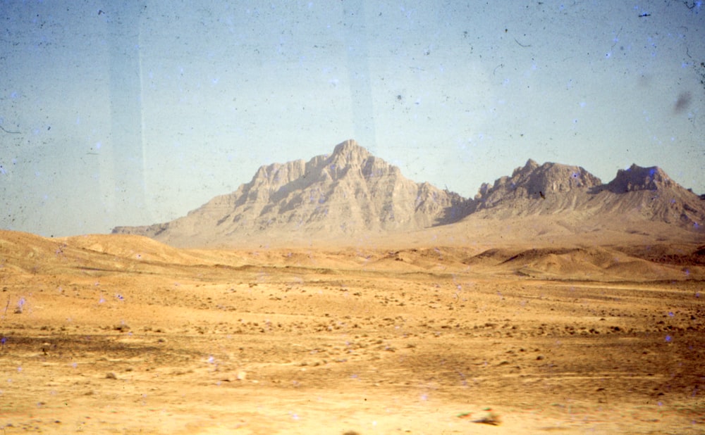 a mountain range in the middle of a desert