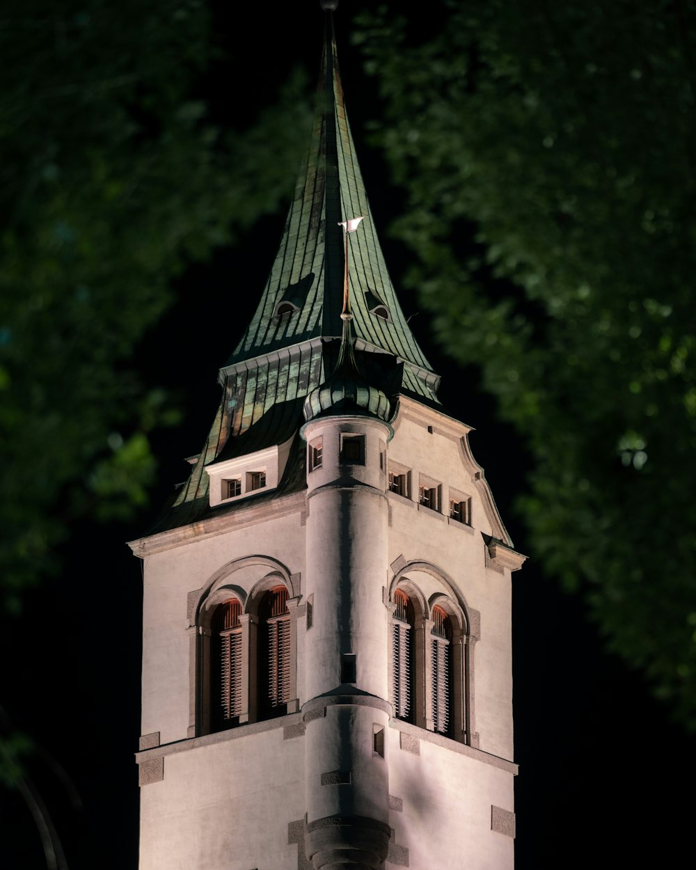 a tall tower with a clock on the top of it