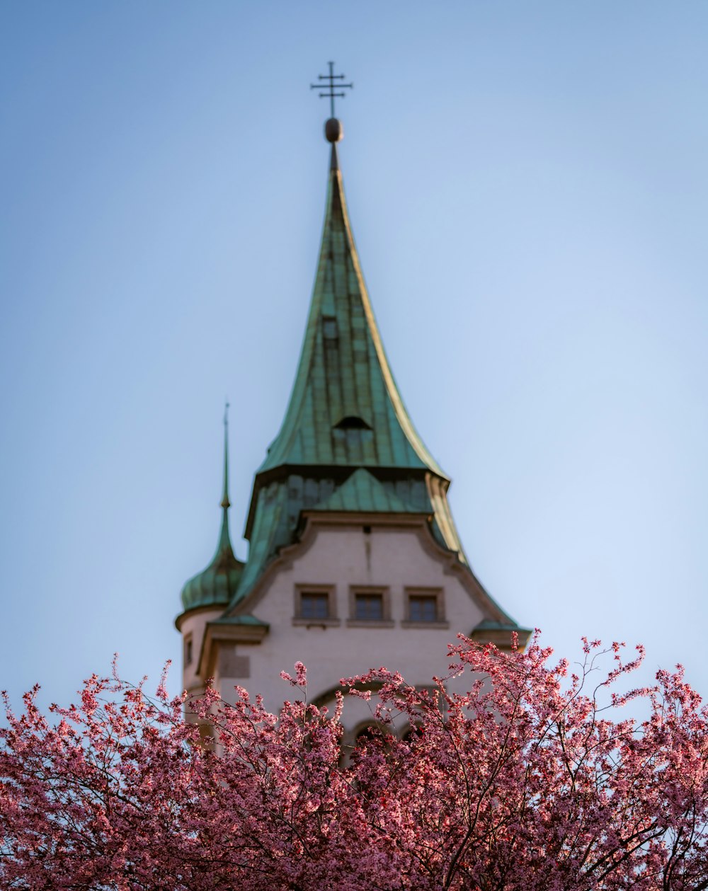 a church steeple with a cross on top of it