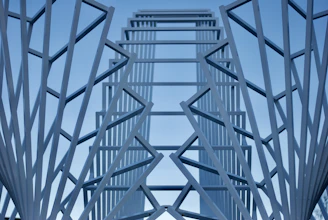 a tall metal structure with a sky in the background
