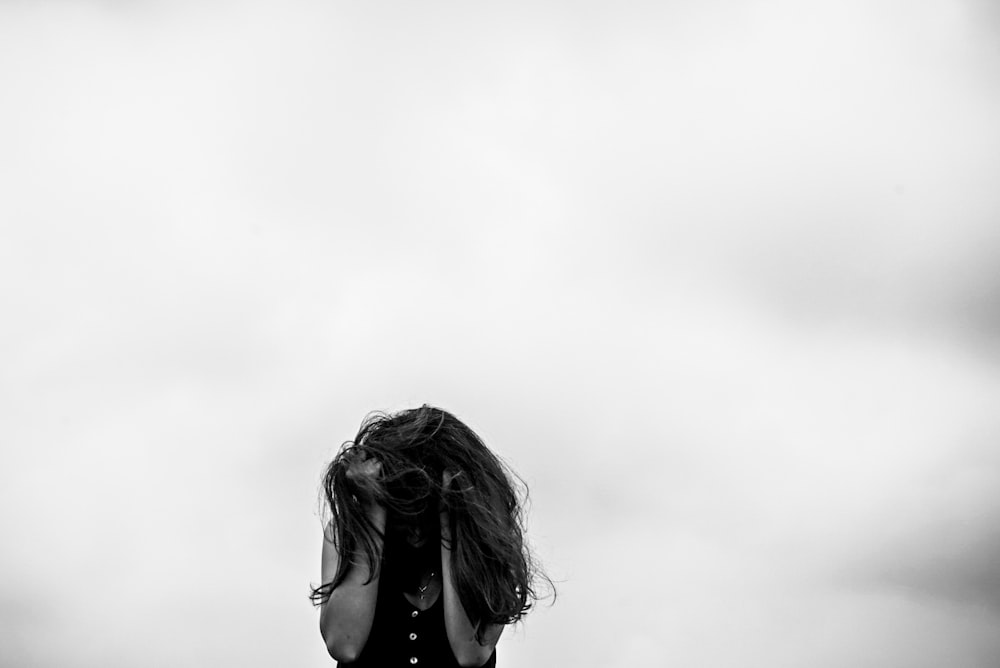 a woman with her hair blowing in the wind