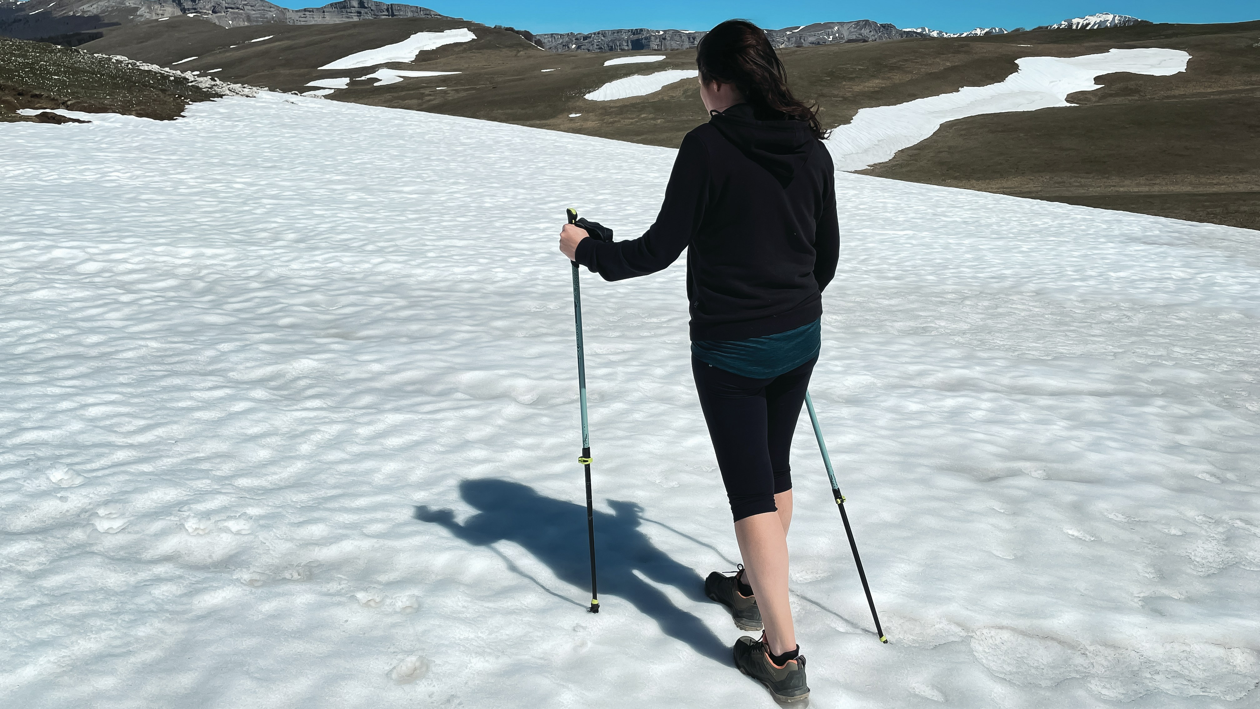 a woman on skis is standing in the snow