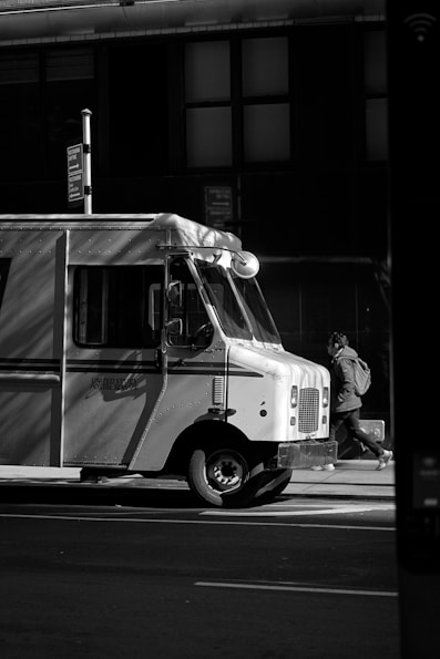 a black and white photo of a food truck
