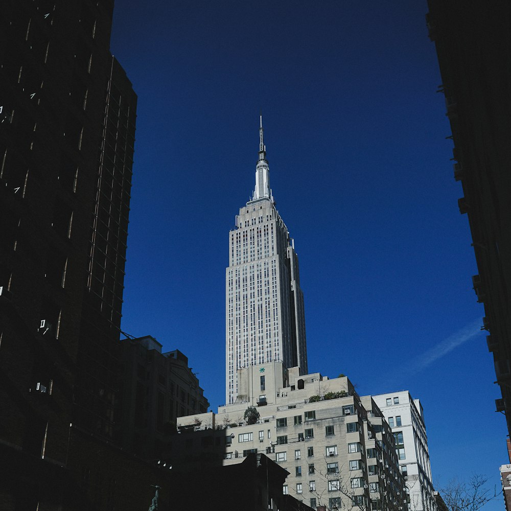 a very tall building towering over a city