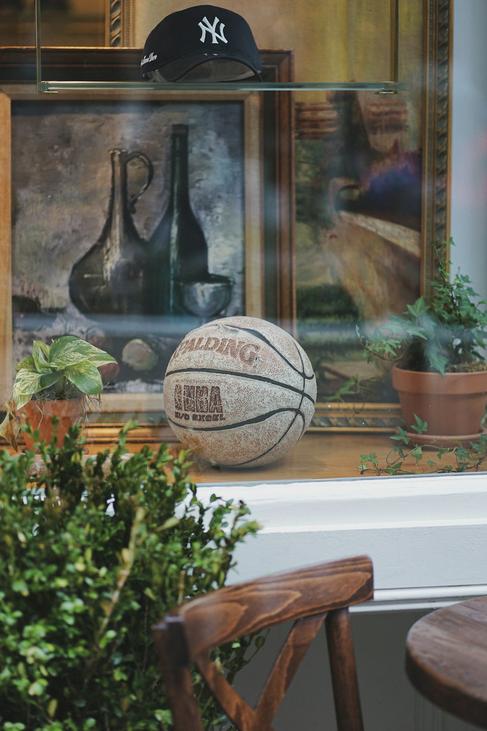 a basketball sitting on top of a window sill