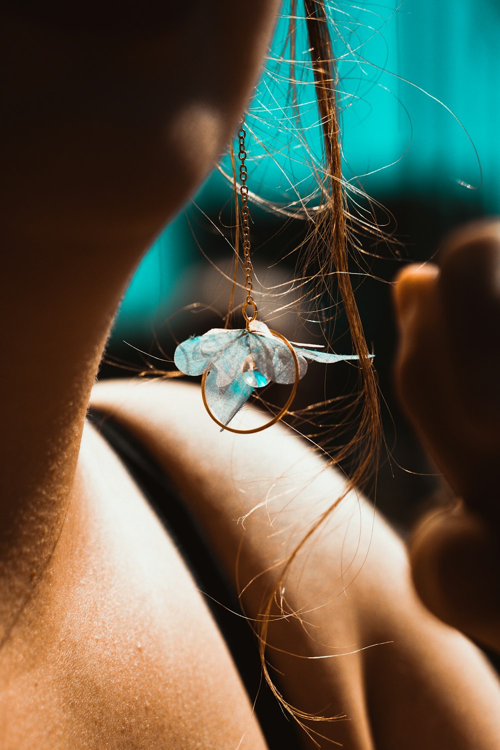 a close up of a person wearing a necklace