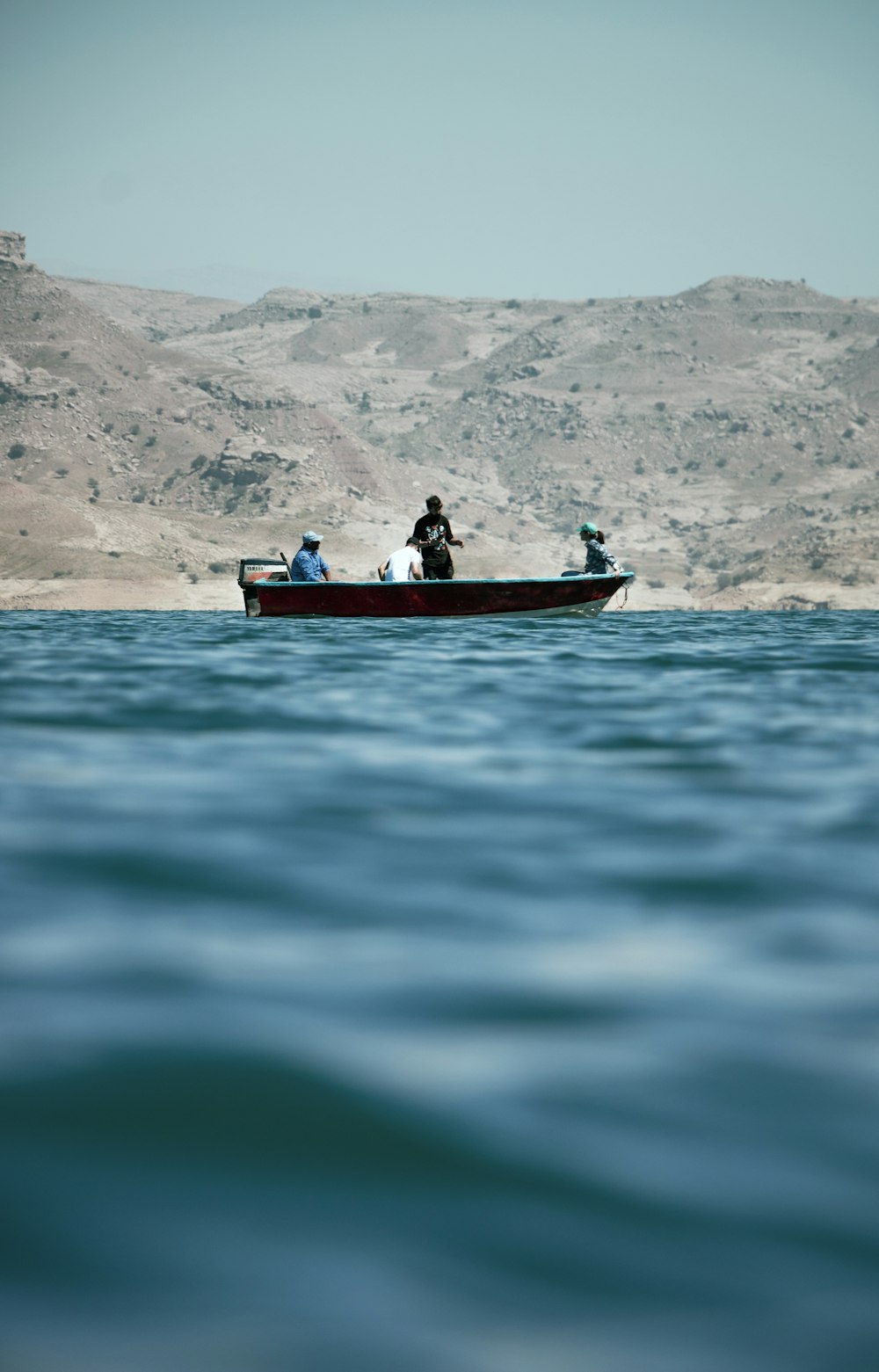 a group of people riding on the back of a boat