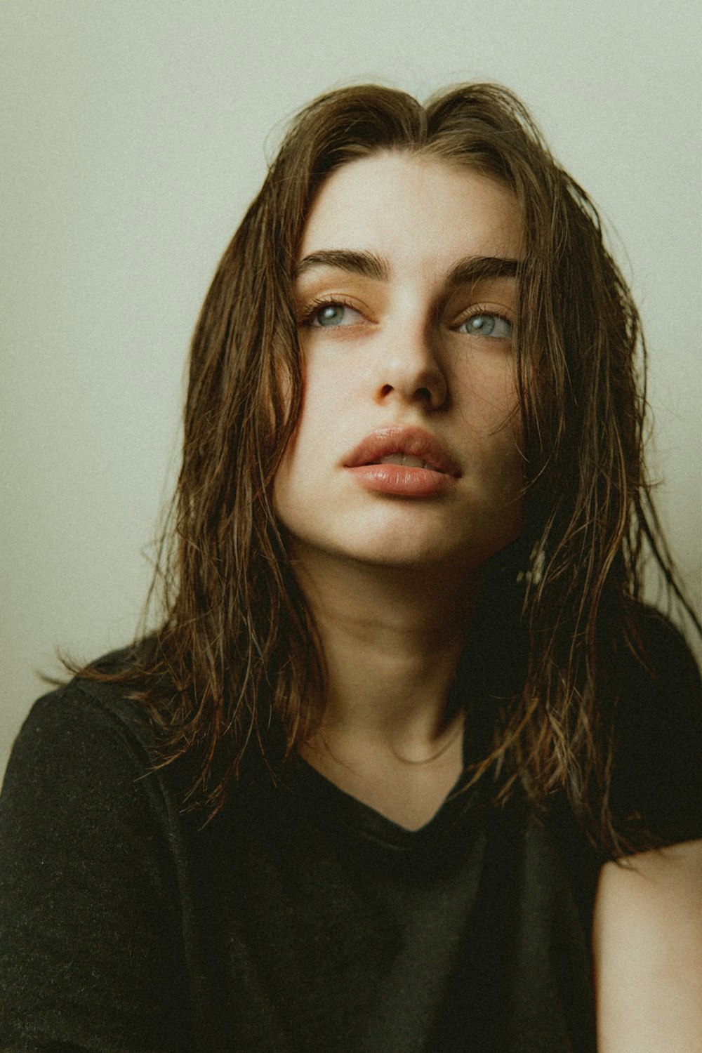 a woman with long hair and a black shirt