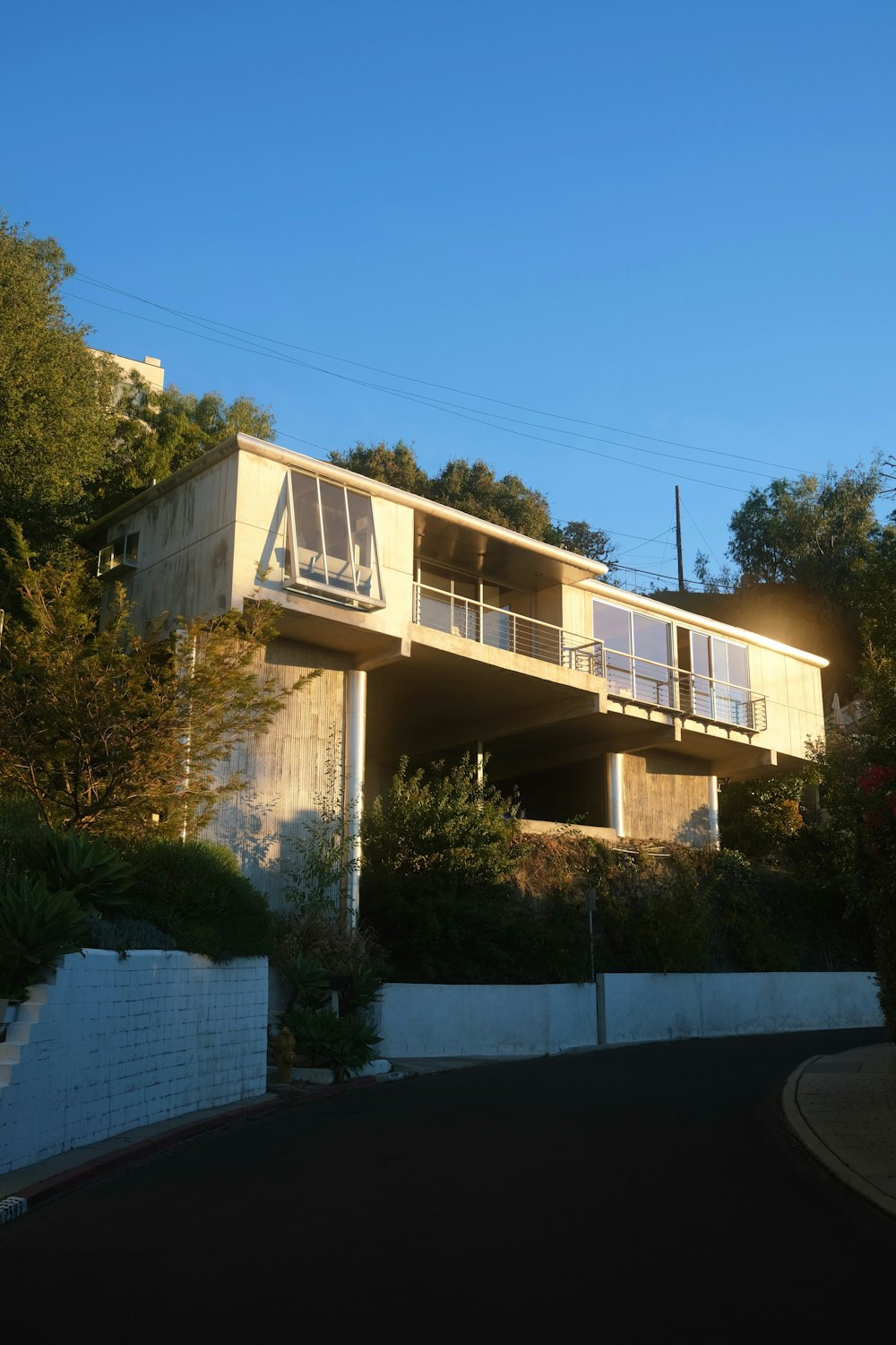 a house with a balcony and a balcony on the top of it