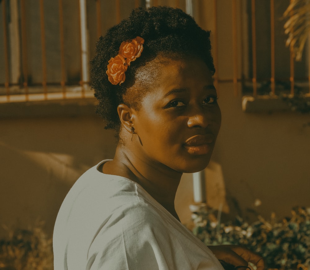 a woman with a flower in her hair