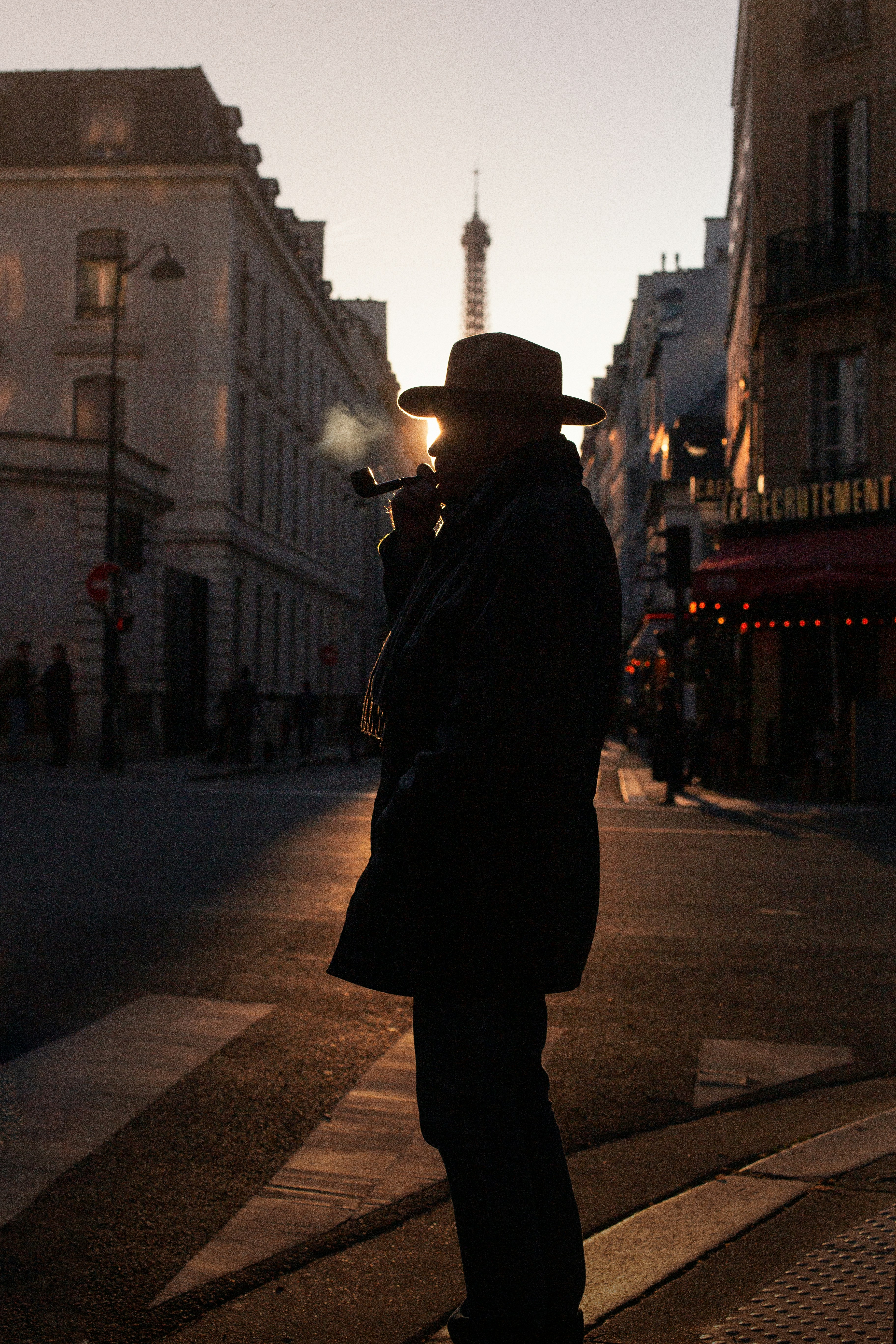 walking cigarette A man standing on the side of a street smoking a cigarette photo – Free Man  Image on Unsplash