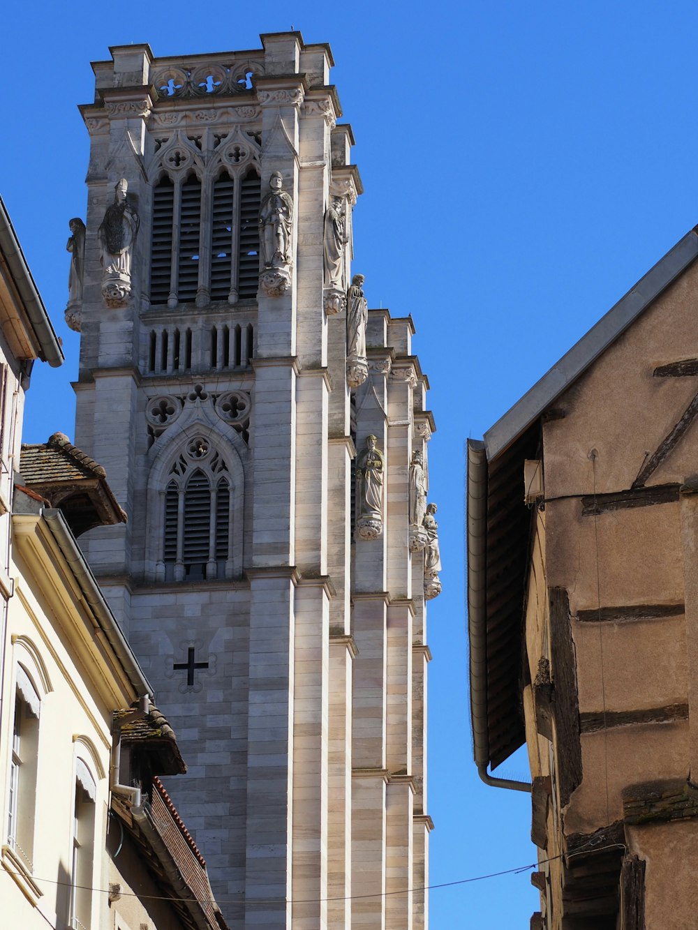 a tall building with a cross on the front of it