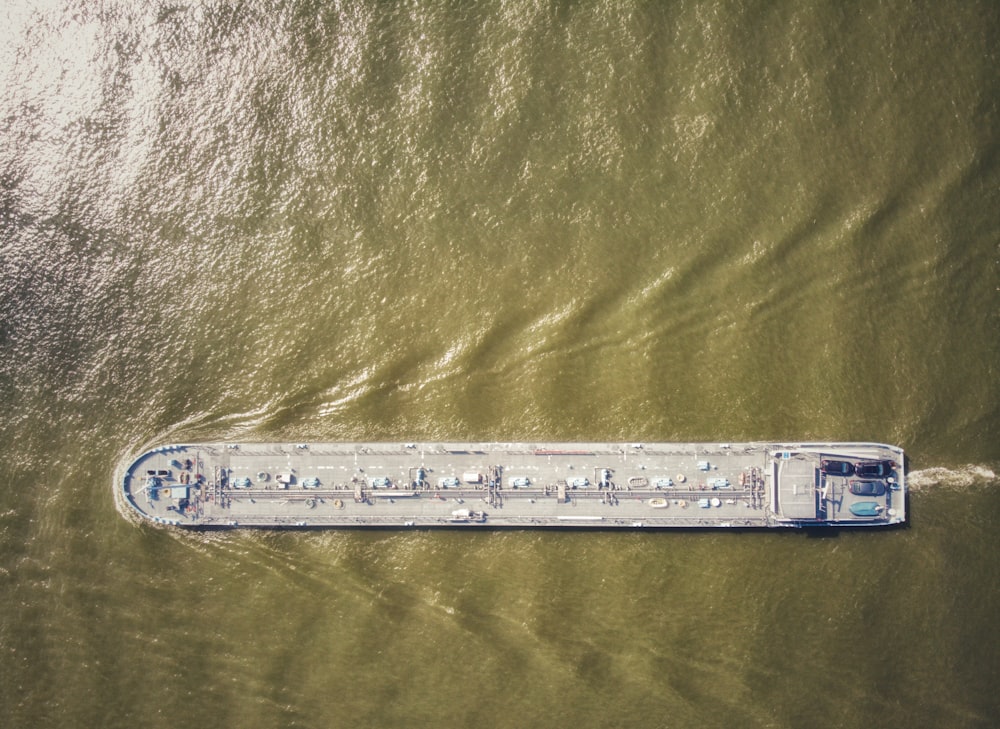 an aerial view of a large boat in the water