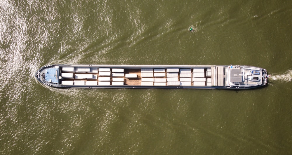 a large boat traveling down a river filled with lots of water