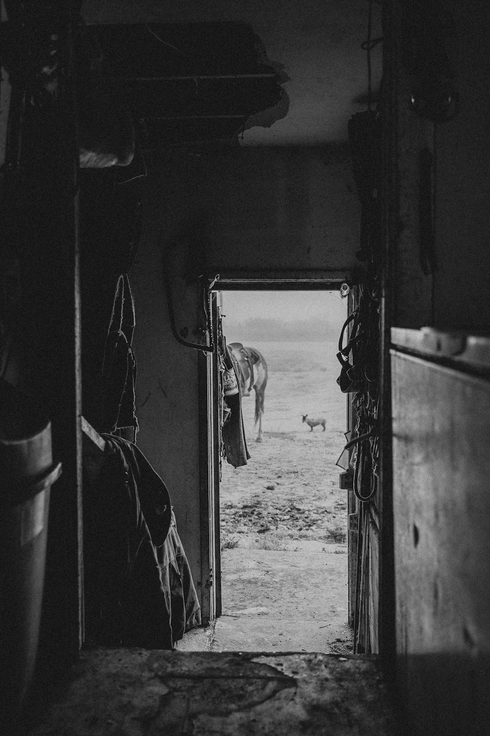 a black and white photo of an open door