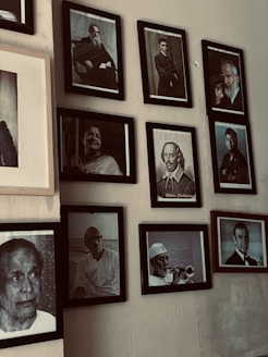 Oval frames arranged in a staggered pattern displaying team member portraits.