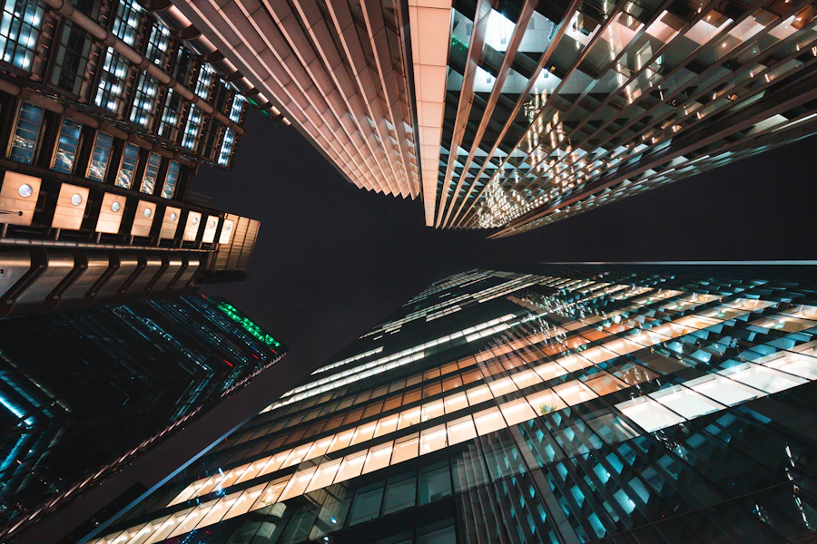 Angular city towers illuminated in blue and amber at night