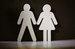 a couple of paper cut out of a man and a woman