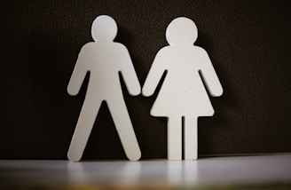 a couple of paper cut out of a man and a woman