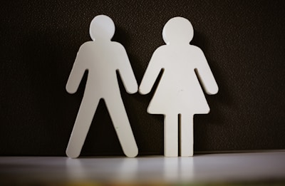 a couple of paper cut out of a man and a woman